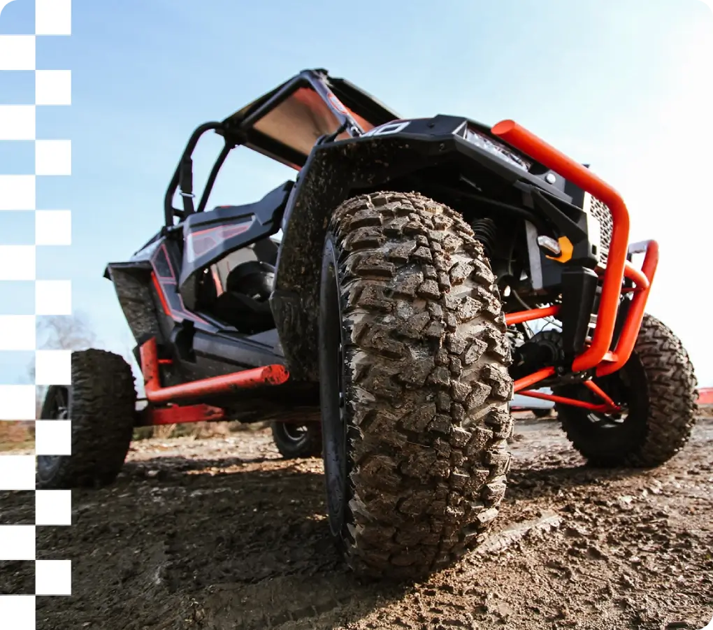 Off-road vehicle on muddy terrain.
