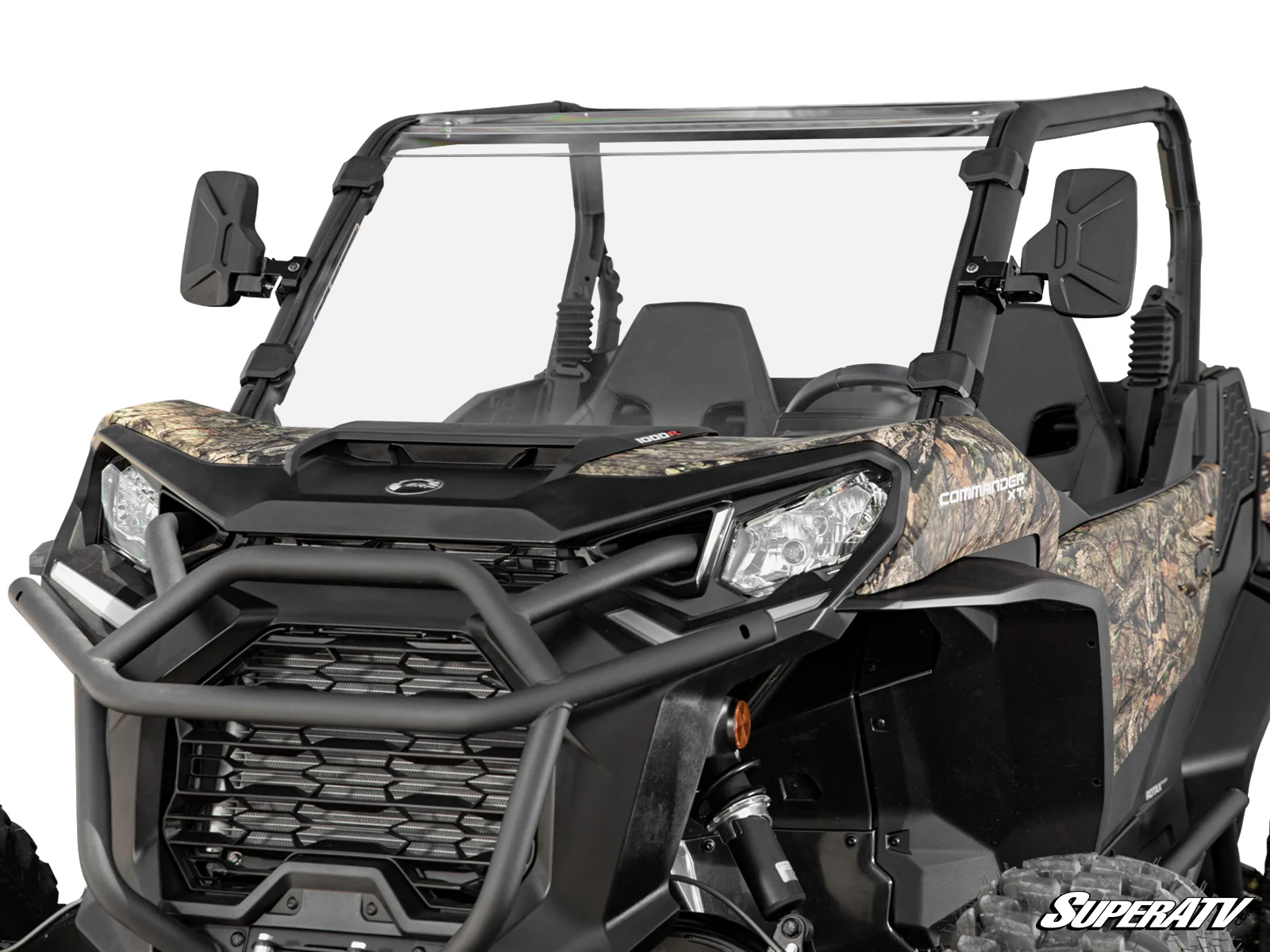Camouflaged off-road vehicle with rugged front design and roll cage.