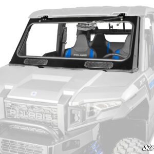 A white off-road vehicle with blue-accented seats and a rugged front grille.