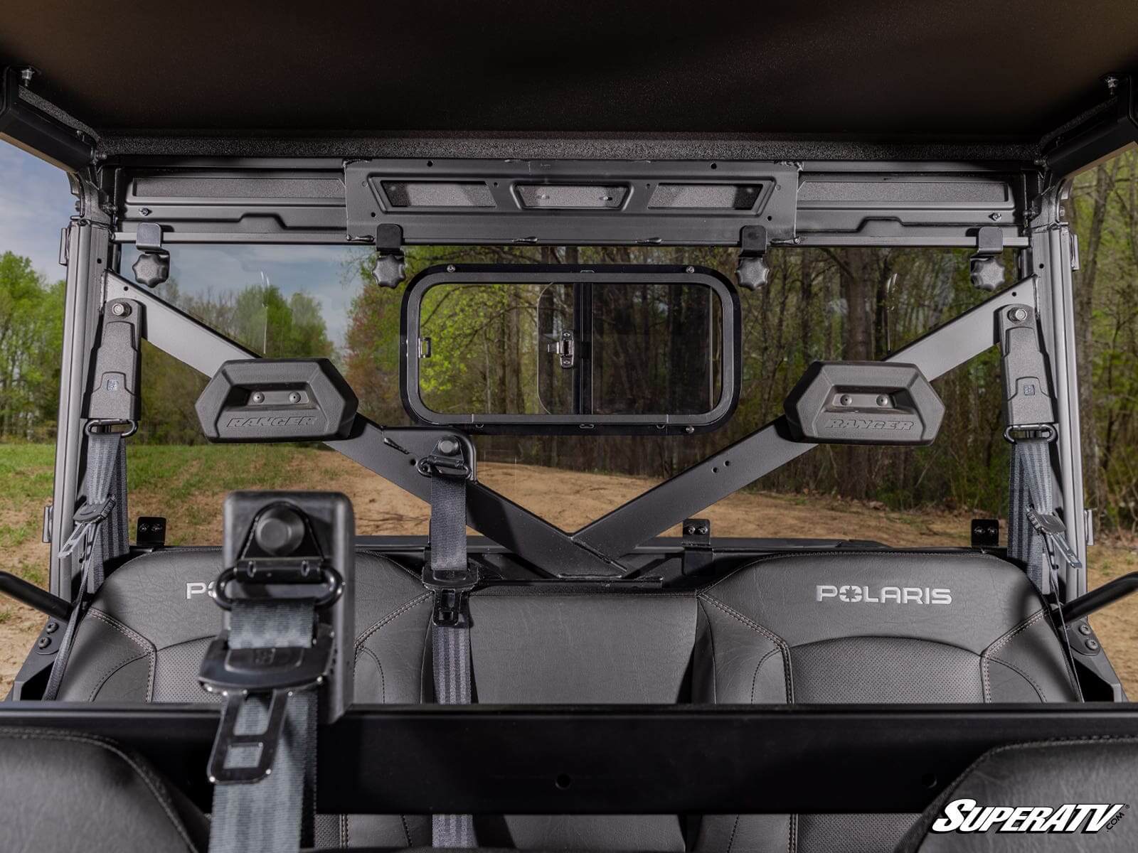 Overhead view of a Polaris off-road vehicle navigating a rugged trail.