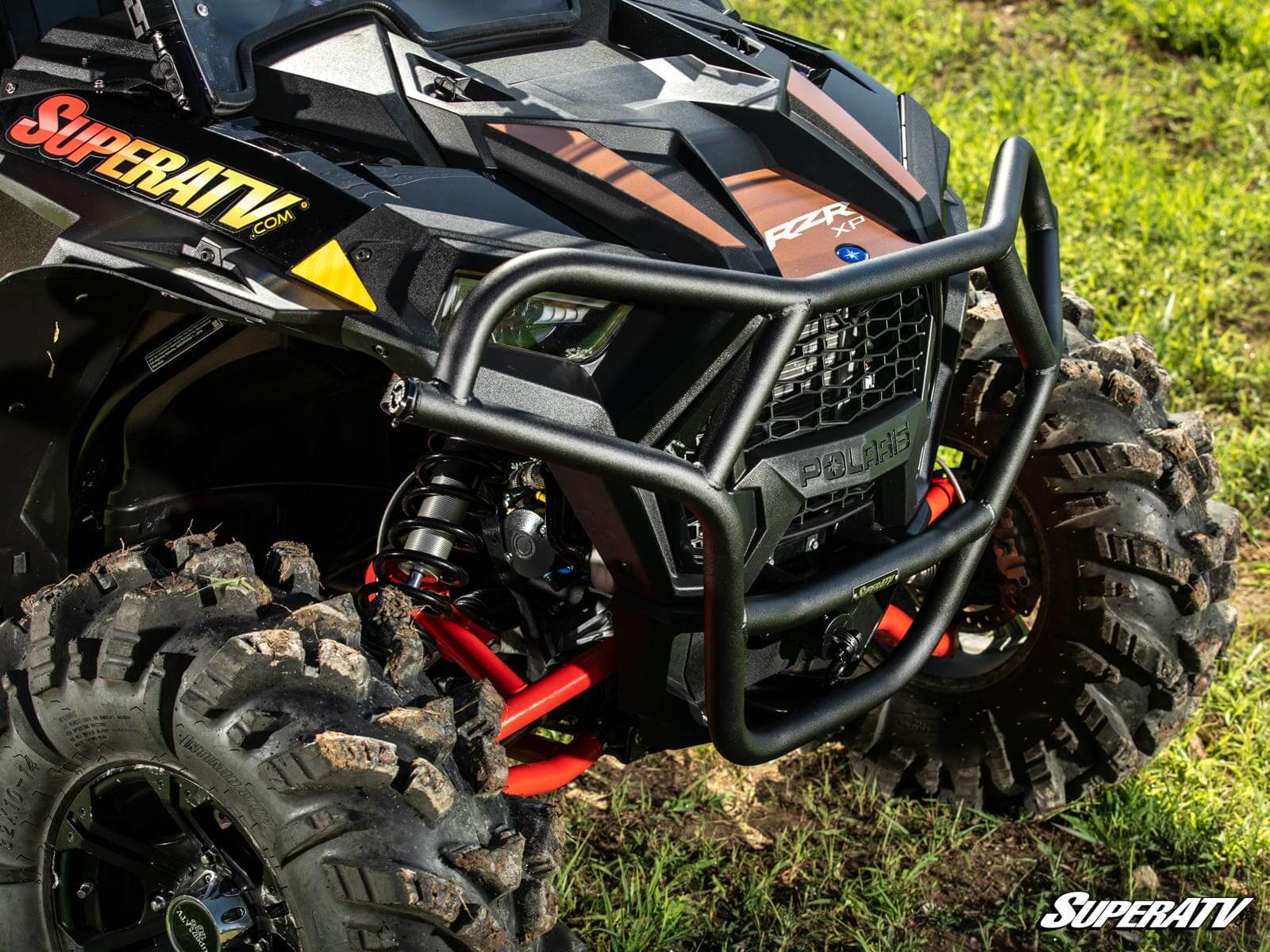 Close-up of a rugged ATV front with heavy-duty bumper and suspension.