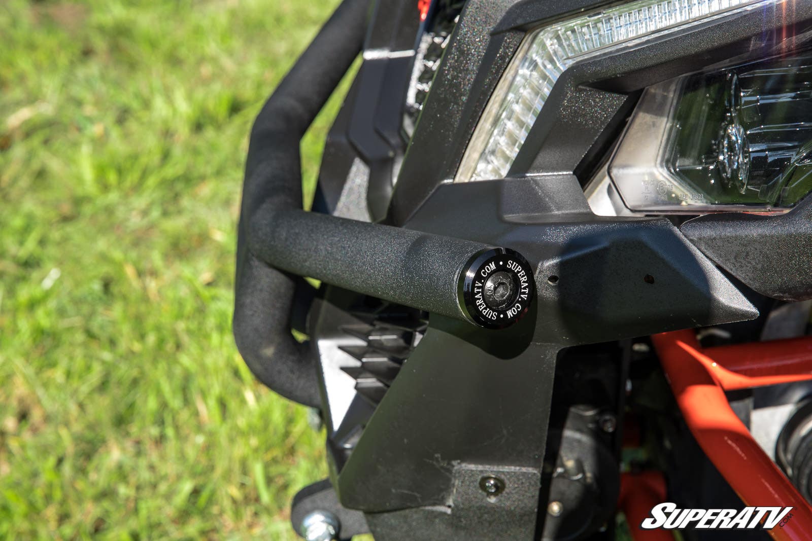 Close-up of a rugged off-road vehicle's front bumper and LED light.