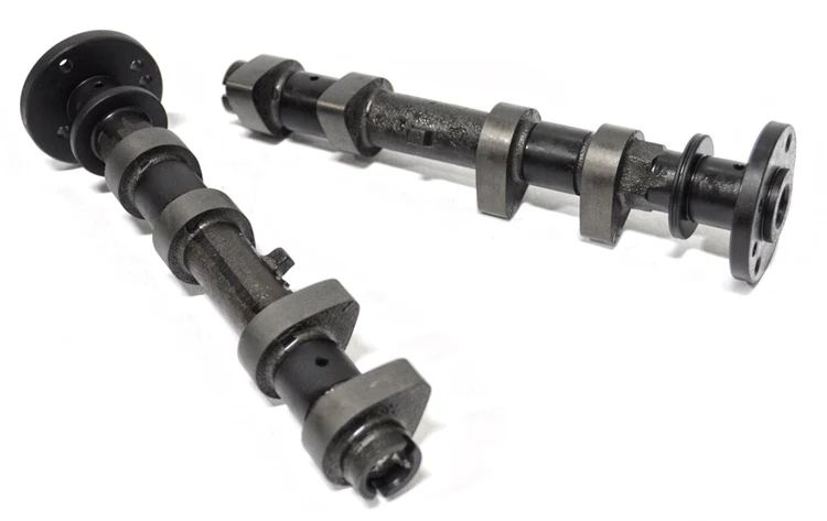 Two black metal camshafts used in engines.