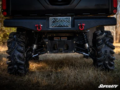 Off-road vehicle rear suspension and tires.
