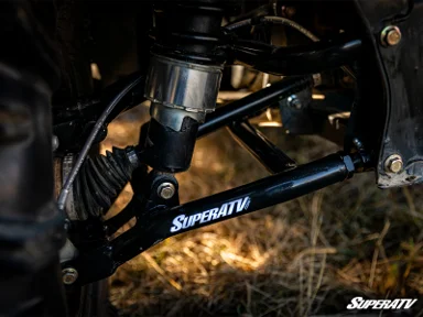 ATV suspension system with SuperATV branding.