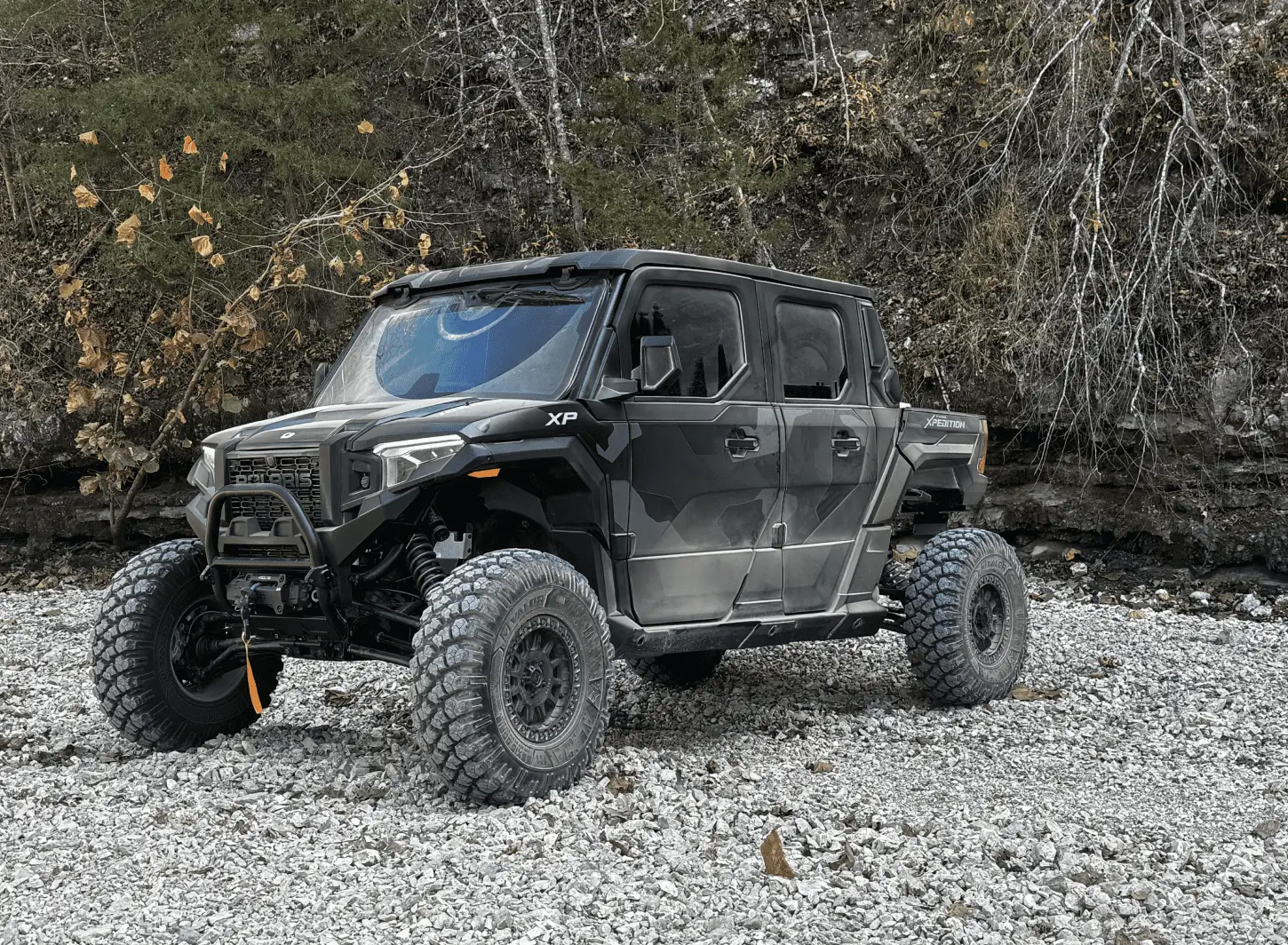 Four-door off-road UTV on rocky ground